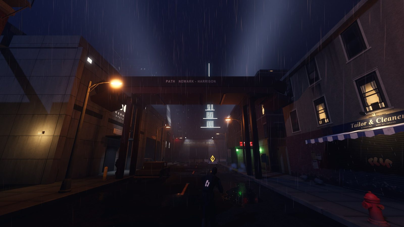 A wet street under the PATH viaduct